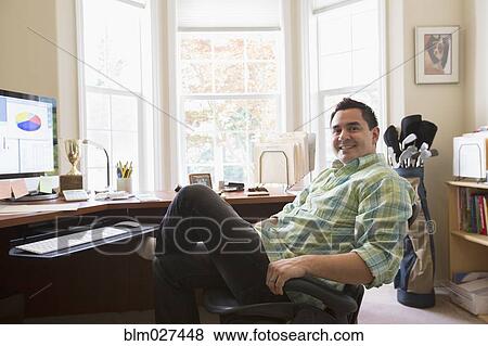 Pacific Islander businessman smiling at desk View Large Photo Image Stock Photo - Pacific Islander businessman smiling at desk. Fotosearch