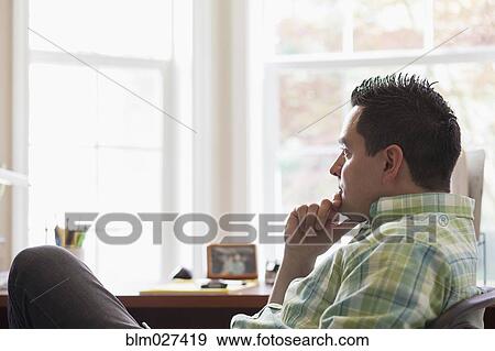 Pacific Islander businessman thinking at desk View Large Photo Image Stock Photo - Pacific Islander businessman thinking at desk. Fotosearch