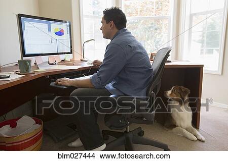 Pacific Islander businessman working at desk View Large Photo Image Picture - Pacific Islander businessman working at desk. Fotosearch