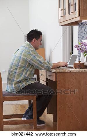 Pacific Islander man using laptop View Large Photo Image Stock Image - Pacific Islander man using laptop. Fotosearch