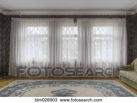 Stock Image - Sheer curtains in sitting room. Fotosearch
