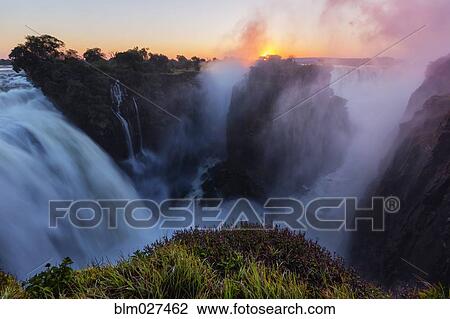 Sunrise over Victoria Falls, Matabeleland North, Zimbabwe View Large Photo Image Stock Image - Sunrise over Victoria Falls, Matabeleland North, Zimbabwe. Fotosearch