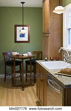 Table and chairs in modern kitchen View Large Photo Image Stock Photograph - Table and chairs in modern kitchen. Fotosearch