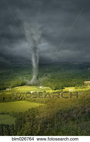 Picture - Tornado rolling through rural landscape. Fotosearch