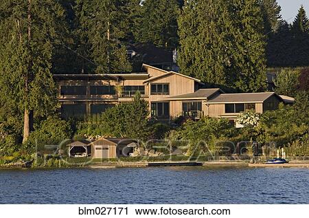 Wooden house overlooking river View Large Photo Image Stock Image - Wooden house overlooking river. Fotosearch