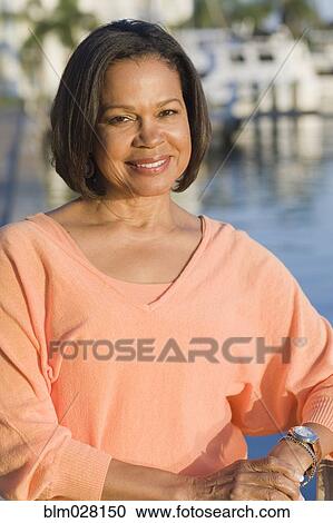 African American woman smiling outdoors View Large Photo Image Stock Image - African American woman smiling outdoors. Fotosearch