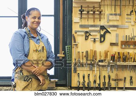 Black carpenter in workshop View Large Photo Image Stock Image - Black carpenter in workshop. Fotosearch