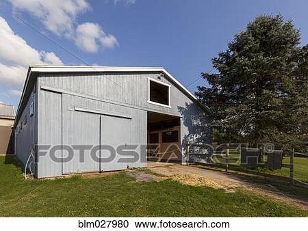 Stock Image - Blue barn on farm. Fotosearch