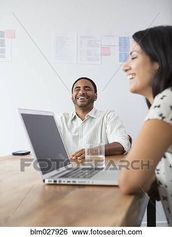 Business people laughing in meeting View Large Photo Image Stock Photograph - Business people laughing in meeting. Fotosearch
