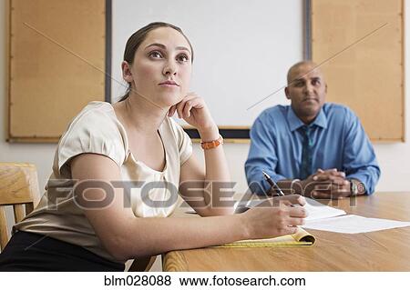Stock Photo - Business people listening in meeting. Fotosearch