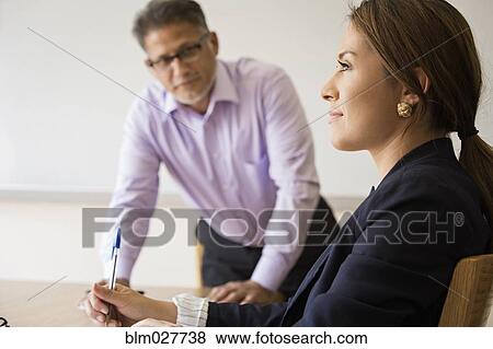 Stock Photo - Business people talking in meeting. Fotosearch