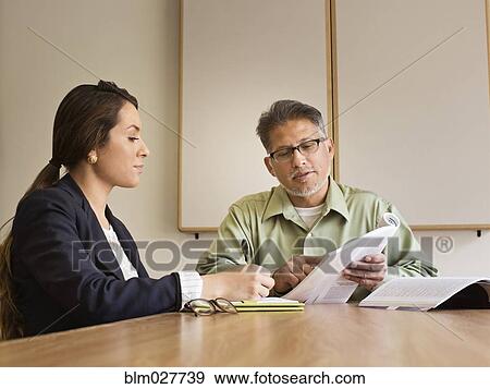 Stock Photo - Business people talking in meeting. Fotosearch