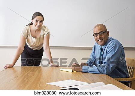 Business people talking in office View Large Photo Image Stock Image - Business people talking in office. Fotosearch