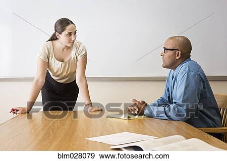 Business people talking in office View Large Photo Image Stock Photo - Business people talking in office. Fotosearch