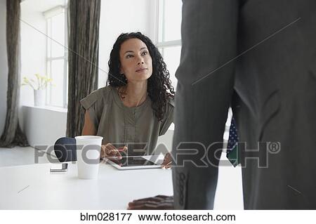 Business people talking in office View Large Photo Image Stock Photo - Business people talking in office. Fotosearch