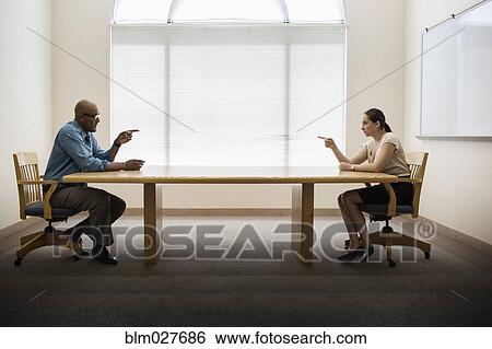 Stock Photograph - Business people talking in office. Fotosearch