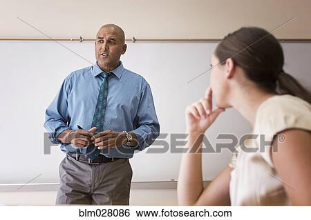 Business people talking in office View Large Photo Image Stock Photograph - Business people talking in office. Fotosearch