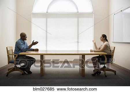 Stock Photography - Business people talking in office. Fotosearch
