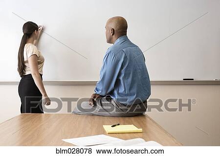 Stock Photo - Business people working in office. Fotosearch