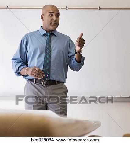 Businessman giving speech in meeting View Large Photo Image Picture - Businessman giving speech in meeting. Fotosearch