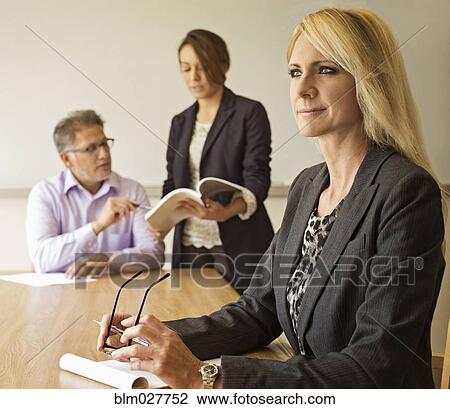 Businesswoman sitting in meeting View Large Photo Image Stock Image - Businesswoman sitting in meeting. Fotosearch