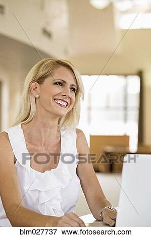 Businesswoman working at laptop View Large Photo Image Stock Photo - Businesswoman working at laptop. Fotosearch