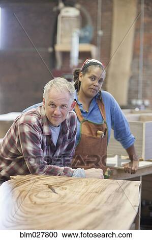 Carpenters smiling in workshop View Large Photo Image Stock Image - Carpenters smiling in workshop. Fotosearch