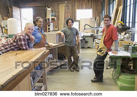 Carpenters smiling in workshop View Large Photo Image Stock Photograph - Carpenters smiling in workshop. Fotosearch
