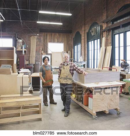 Carpenters standing in workshop View Large Photo Image Stock Photography - Carpenters standing in workshop. Fotosearch