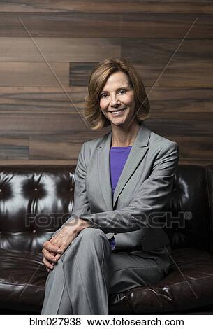 Stock Photo - Caucasian businesswoman smiling in office. Fotosearch