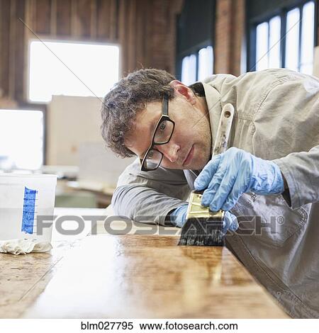 Caucasian carpenter working in workshop View Large Photo Image Stock Photography - Caucasian carpenter working in workshop. Fotosearch