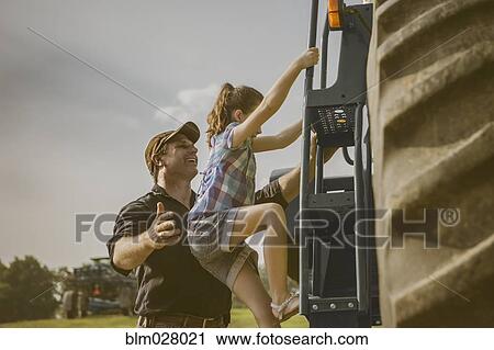 Caucasian father and daughter working on farm View Large Photo Image Stock Image - Caucasian father and daughter working on farm. Fotosearch