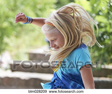 Caucasian girl jumping for joy outdoors View Large Photo Image Stock Photo - Caucasian girl jumping for joy outdoors. Fotosearch