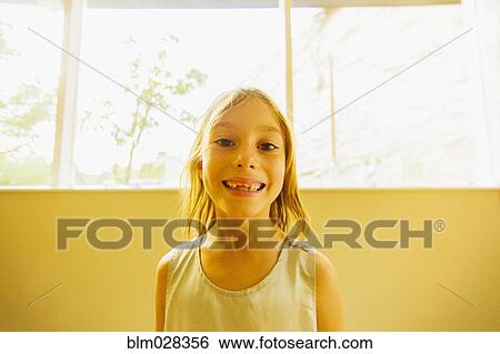 Caucasian girl showing gaps in teeth View Large Photo Image Stock Photograph - Caucasian girl showing gaps in teeth. Fotosearch