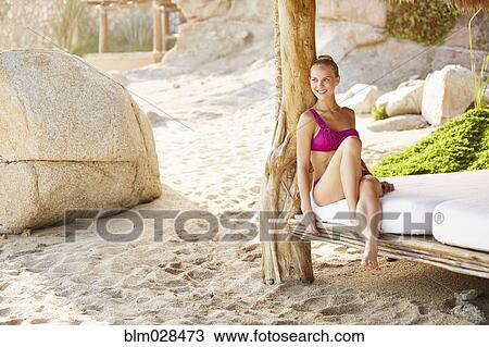 Caucasian woman relaxing in cabana View Large Photo Image Stock Image - Caucasian woman relaxing in cabana. Fotosearch