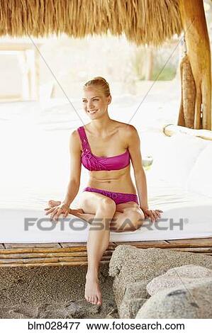 Caucasian woman relaxing in cabana View Large Photo Image Stock Photo - Caucasian woman relaxing in cabana. Fotosearch