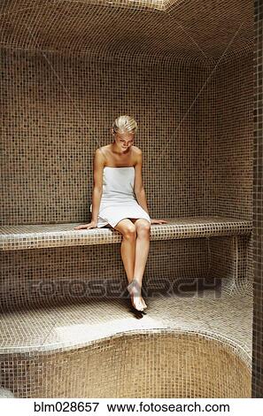 Caucasian woman relaxing in sauna View Large Photo Image Stock Photo - Caucasian woman relaxing in sauna. Fotosearch