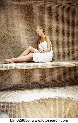 Stock Photograph - Caucasian woman relaxing in sauna. Fotosearch