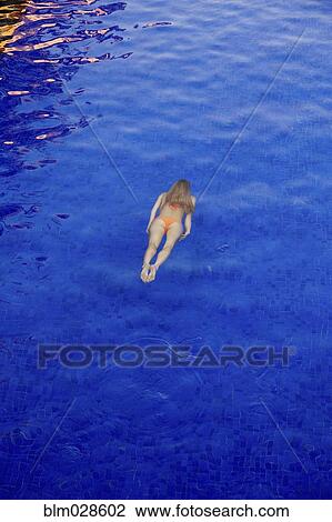 Caucasian woman swimming underwater View Large Photo Image Stock Image - Caucasian woman swimming underwater. Fotosearch
