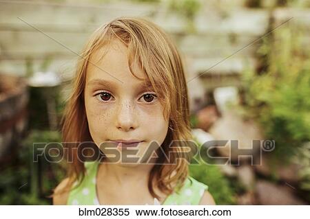 Stock Photography - Close up of Caucasian girl's face. Fotosearch