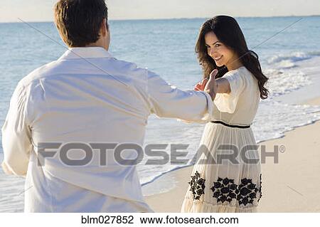 Couple dancing on beach View Large Photo Image Stock Image - Couple dancing on beach. Fotosearch