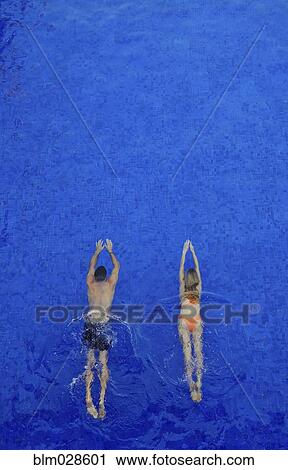 Couple swimming underwater View Large Photo Image Stock Image - Couple swimming underwater. Fotosearch