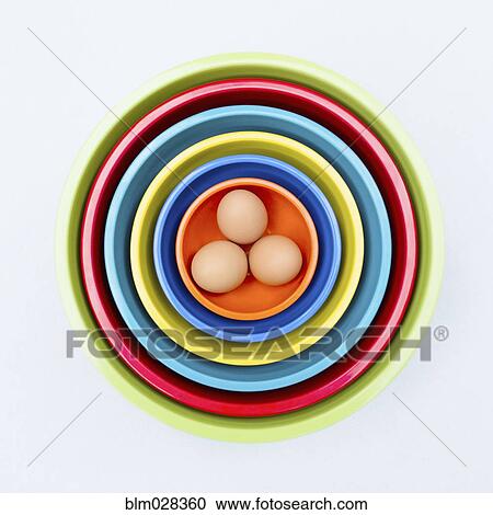 Eggs in colorful nesting bowls View Large Photo Image Stock Image - Eggs in colorful nesting bowls. Fotosearch