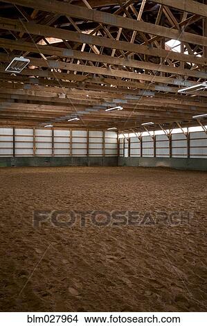 Picture - Empty indoor horse riding ring. Fotosearch