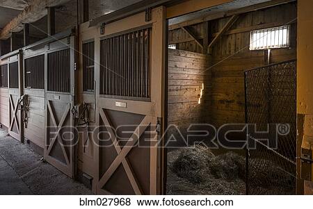 Stock Photo - Empty stables in barn. Fotosearch