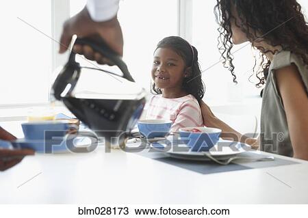 Family at breakfast table View Large Photo Image Stock Image - Family at breakfast table. Fotosearch
