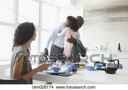 Father and daughter hugging in kitchen View Large Photo Image Picture - Father and daughter hugging in kitchen. Fotosearch