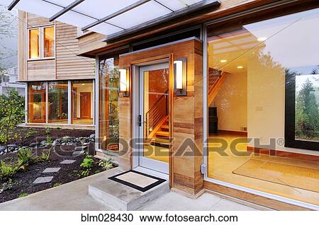 Stock Image - Glass windows and doors of modern house. Fotosearch