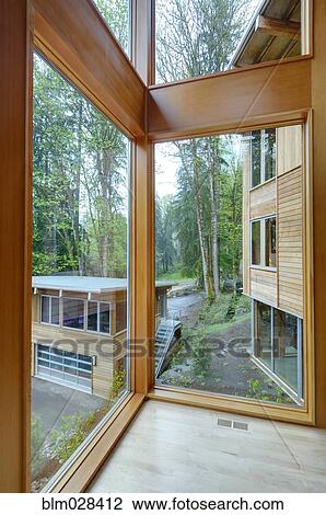 Stock Image - Glass windows of modern house. Fotosearch