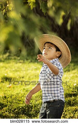 Hispanic boy playing outdoors View Large Photo Image Stock Photography - Hispanic boy playing outdoors. Fotosearch